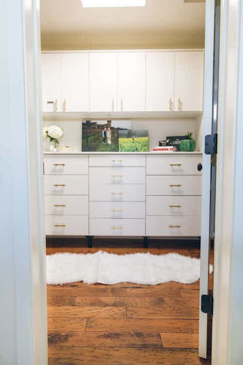 white closet with matching cabinets